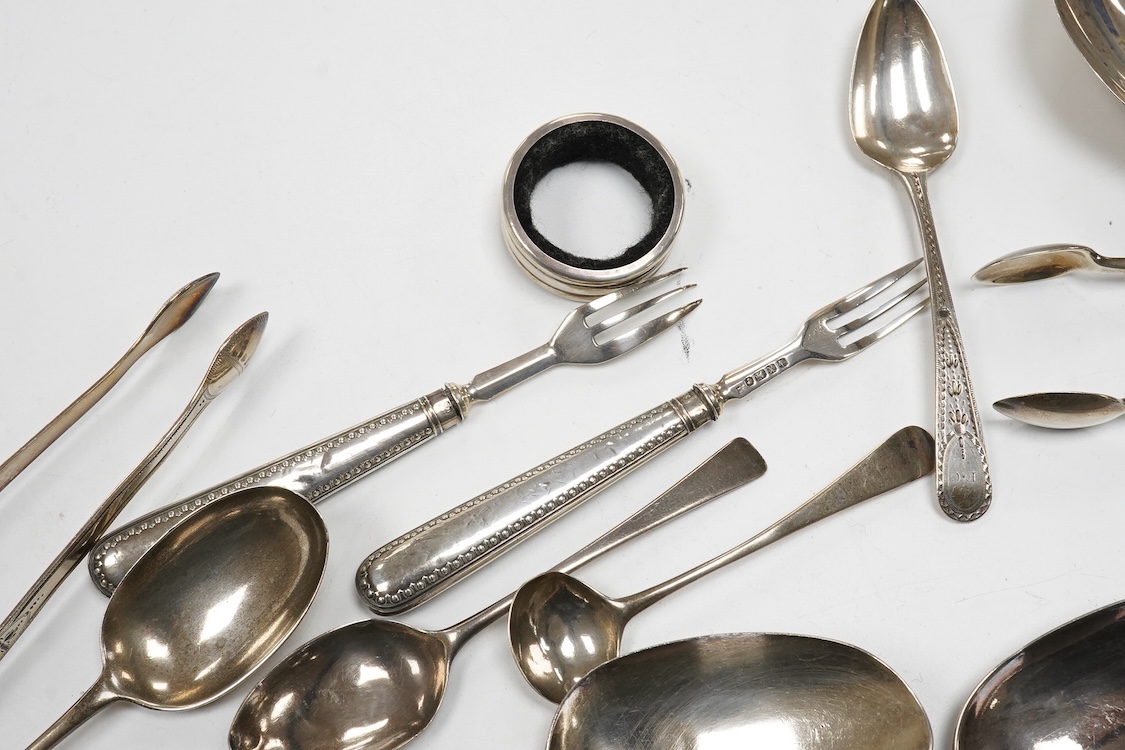 A collection of small silver and white metal items, including an Indian Hamilton & Co small dish, the centre inset with 1840 one rupee coin, one other white metal dish, two modern silver mounted napkin rings, fourteen as